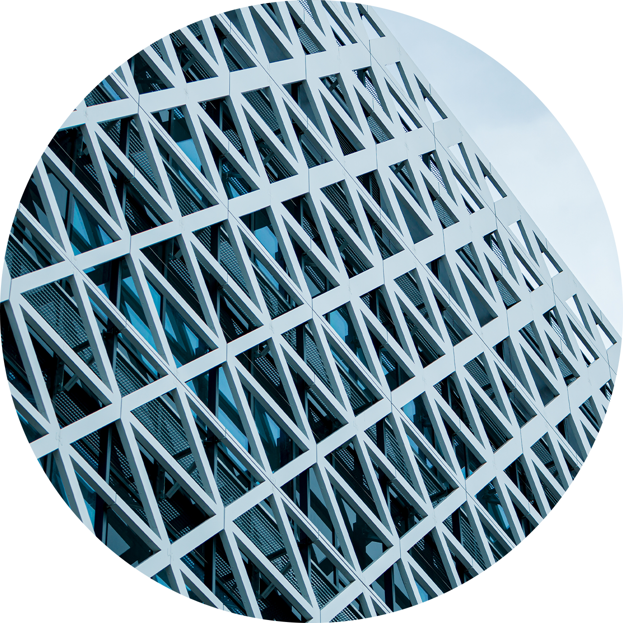 Geometric window pattern with light blue sky overhead